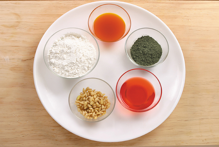 Ingredients for maejakgwa include flour, cooking oil, salt, powdered mugwort, strawberry and gardenia, and syrup.