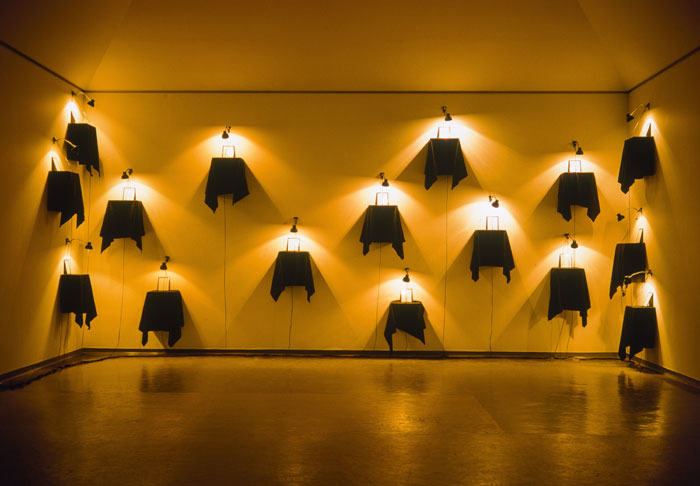 Christian Boltanski uses lanterns, wooden boxes and black cloth to create the above installation work 'Monument-Comfort Women' (1997).
